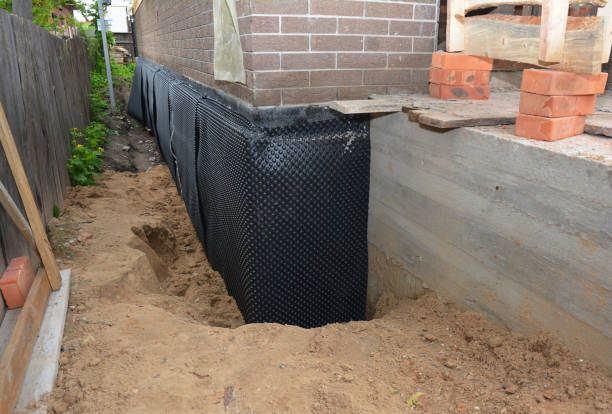 SJ Waterproofing Pros technician performing targeted Emergency Waterproofing assessment in Yorkshire, OH